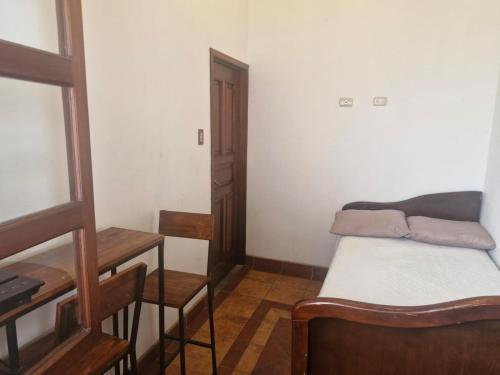 Ένα ή περισσότερα κρεβάτια σε δωμάτιο στο Charming Colonial Villa Azotea