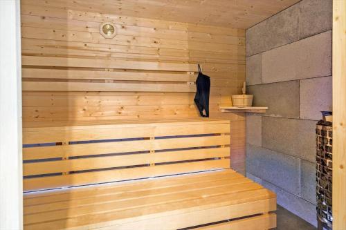 a sauna with a wooden paneled wall at LF10058-Thyholm-Fyrrevej-17 in Thyholm
