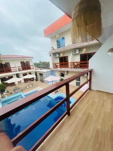 a view from the balcony of a building with a swimming pool at Hotel MELAO in Pedernales