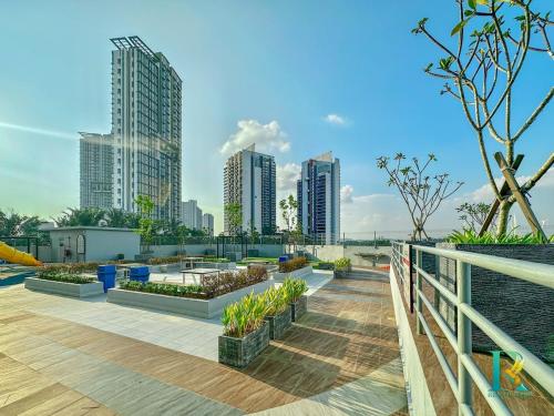 a rooftop garden in a city with tall buildings at Optimus Medini By RR JBcity in Iskandar Puteri