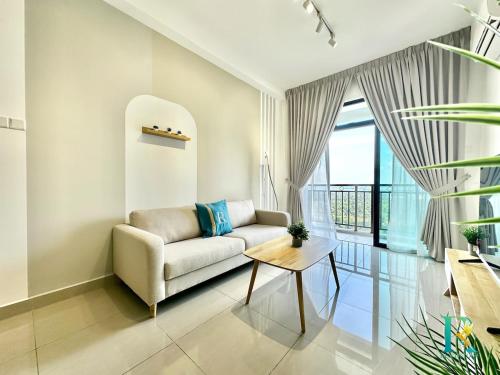 a living room with a couch and a table at Optimus Medini By RR JBcity in Iskandar Puteri