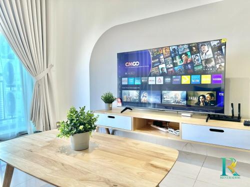 a living room with a large flat screen tv at Optimus Medini By RR JBcity in Iskandar Puteri