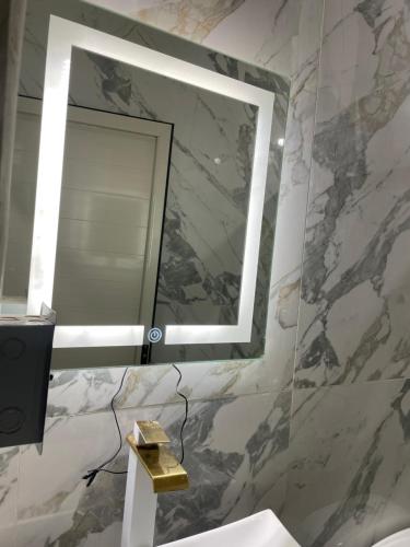 a bathroom with a mirror and a sink at Casa Tequila Club in Arandas