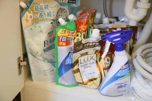 a shelf with toothbrushes and other products on it at グッドタイム新城 in Aomori