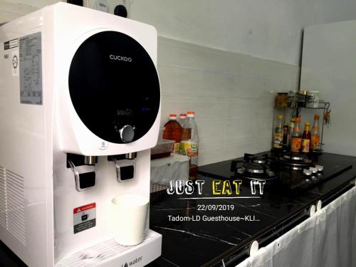 a coffee machine sitting on a counter in a kitchen at KLIA Guesthouse-3 bedroom 2 bathroom in Banting