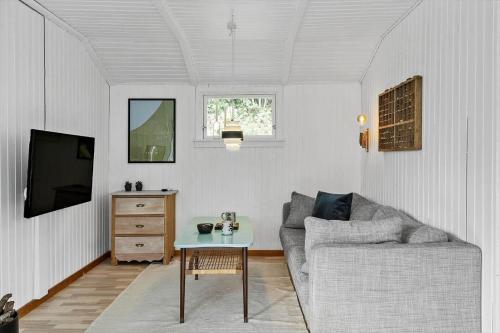 a living room with a couch and a table at LF11108-Struer-Barsidalvej-8 in Struer