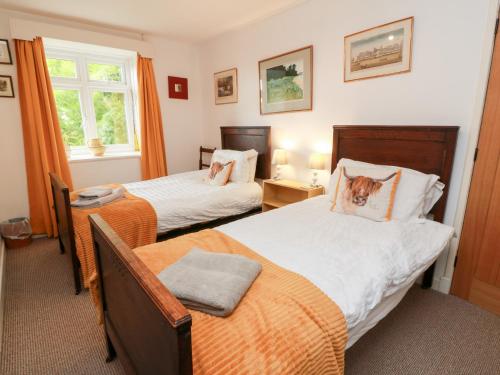 Postel nebo postele na pokoji v ubytování Charlies Cottage