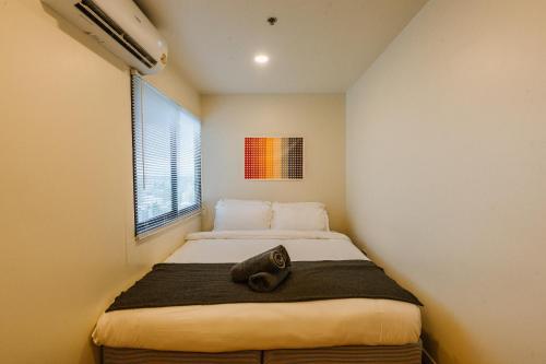 Ένα ή περισσότερα κρεβάτια σε δωμάτιο στο Janatyy Apartment Hatyai