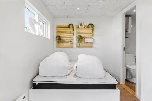 two pillows sitting on a bed in a room at LF13170-Nykobing-mors-Havevej-22 in Nykøbing Mors