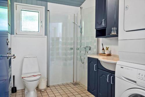a bathroom with a toilet and a glass shower at LF159-Vestervig-Gunhildsvej-39 in Vestervig