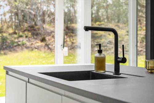 a kitchen counter with a sink and a window at LF302-Hurup-Helligsovej-2-F in Hurup