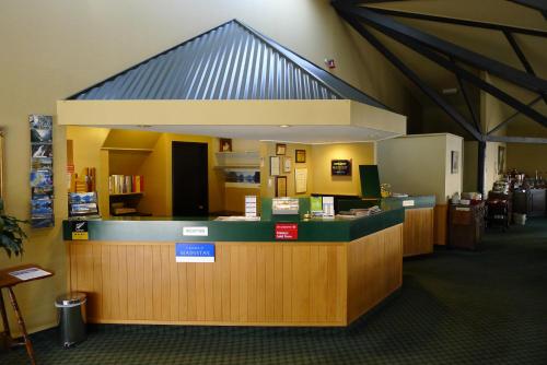 a large room with a large counter and a large window at The Village Inn Hotel in Te Anau