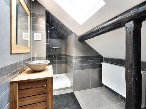a bathroom with a sink and a bath tub at Walk Luxury Stay with Pool in Robertville