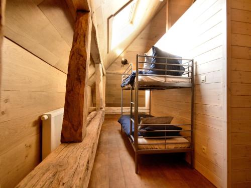 a room with two bunk beds in a cabin at Walk Luxury Stay with Pool in Robertville