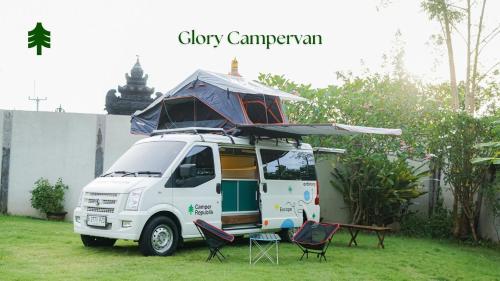 a white van with a tent on top of it at Campervan Rental Bali - Camper Republik in Dalung
