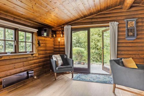 a room with two chairs and a desk and windows at LF14362-Roslev-Nautrupvej-62 in Roslev