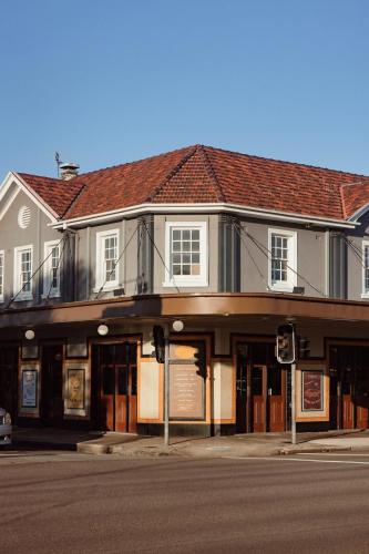 a building on the corner of a street at Islington Barracks Hotel in Hamilton