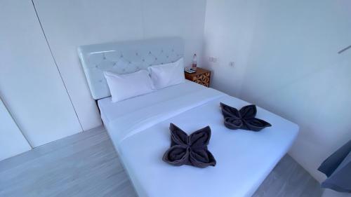 Ένα ή περισσότερα κρεβάτια σε δωμάτιο στο Idea's Villa Pangandaran