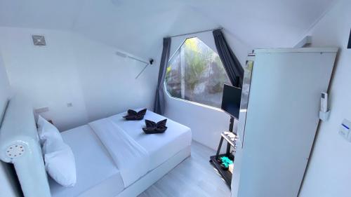 Ένα ή περισσότερα κρεβάτια σε δωμάτιο στο Idea's Villa Pangandaran