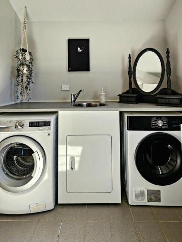 a kitchen with a washing machine and a sink at Peaceful 1BR Escape Perfect Katoomba Leura Base in Katoomba
