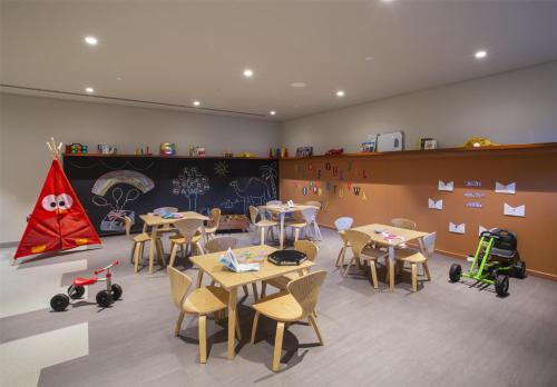a classroom with tables and chairs and toy vehicles at Alila Hinu Bay Salalah Mirbat in Salalah