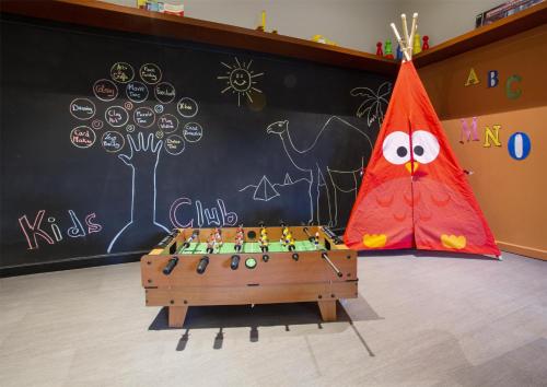 a classroom with a chess board and a red kite at Alila Hinu Bay Salalah Mirbat in Salalah