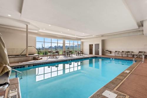 a large pool with blue water in a hotel room at Comfort Inn & Suites at Sanford Sports Complex in Sioux Falls
