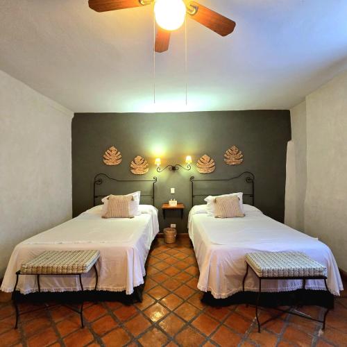 Postel nebo postele na pokoji v ubytování Hotel Casa Morena