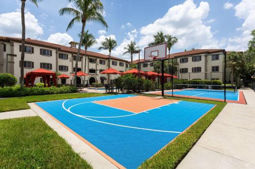 a basketball court in front of a building at Hawthorn Extended Stay by Wyndham Naples in Naples