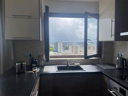 Η κουζίνα ή μικρή κουζίνα στο Appartement stunning view Paris