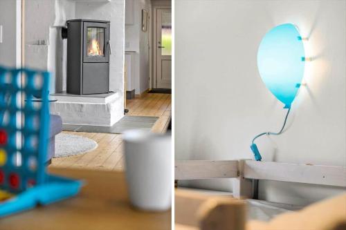 two pictures of a living room with a blue mirror at OH506-Hadsund-Gl-Hedegaardsvej-4 in Hadsund