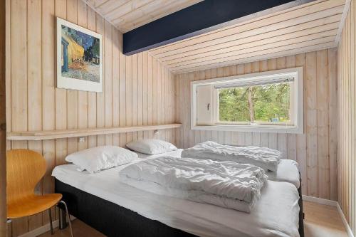 a bedroom with two beds and a window at 2726-Nexo-Fjaelstaunijn-14 in Vester Sømarken