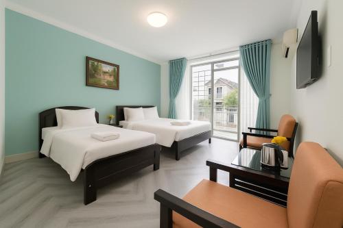 Ένα ή περισσότερα κρεβάτια σε δωμάτιο στο KHKO Charisse Hotel Delhi Darbar