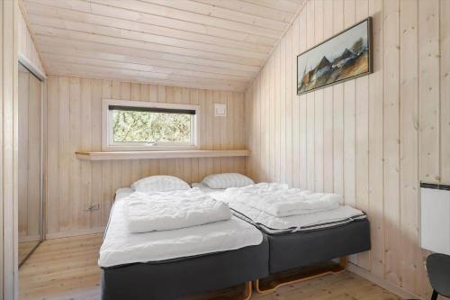 a small room with two beds in it at 2722-Nexo-Jaegerstien-6 in Neksø