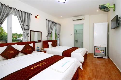 Llit o llits en una habitació de Blue Clouds Homestay