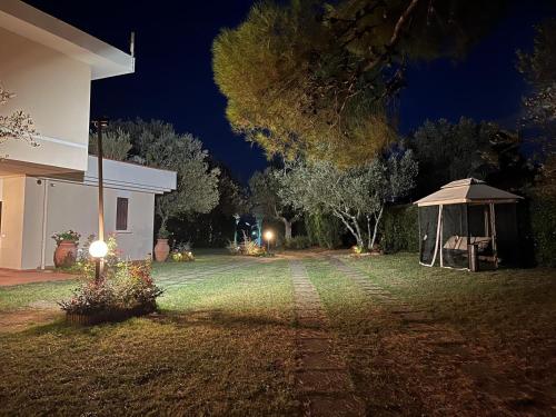 a yard at night with a gazebo at Residence Poggio Golf Chianti Firenze in Impruneta