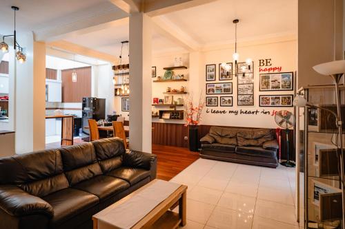 a living room with a couch and a table at INEZ Homestay in Timuran