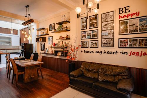 a living room with a couch and a table at INEZ Homestay in Timuran