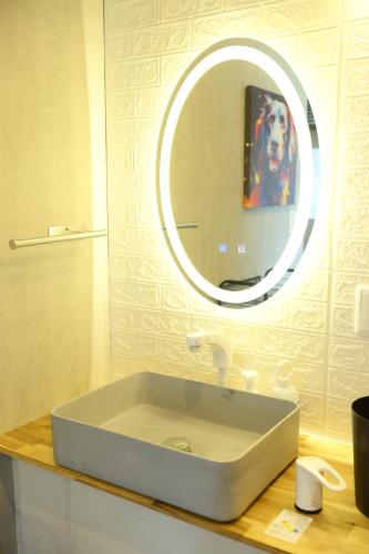 a bathroom with a sink and a mirror at グッドタイム細越 in Aomori