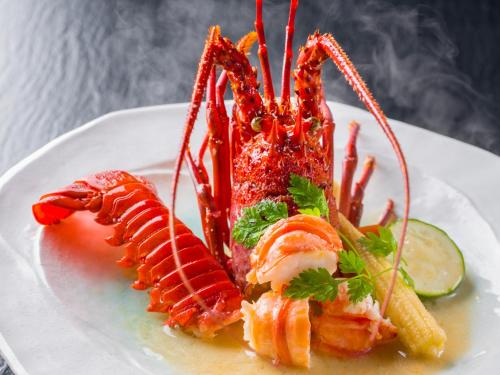 a plate of food with shrimp and french fries at Ryoso Uminocho in Ise