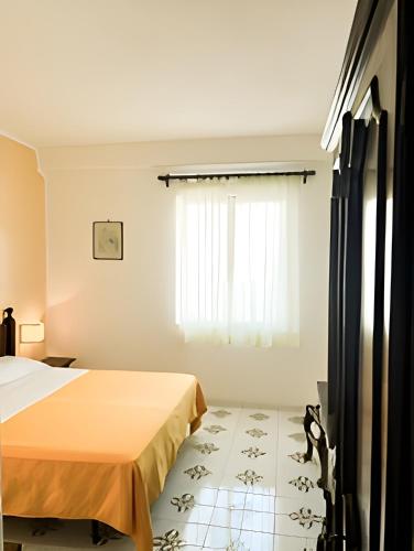 Postel nebo postele na pokoji v ubytování Hotel Belsole