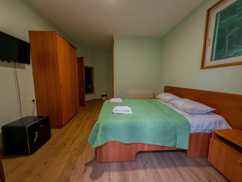 Postel nebo postele na pokoji v ubytování Nunisi Forest Hotel & SPA
