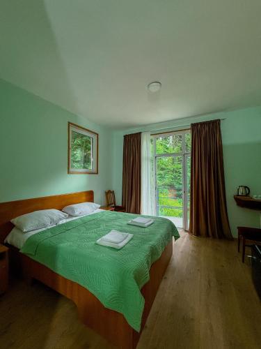 Postel nebo postele na pokoji v ubytování Nunisi Forest Hotel & SPA