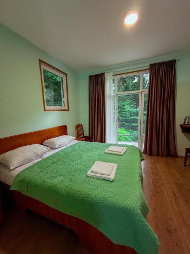 Postel nebo postele na pokoji v ubytování Nunisi Forest Hotel & SPA