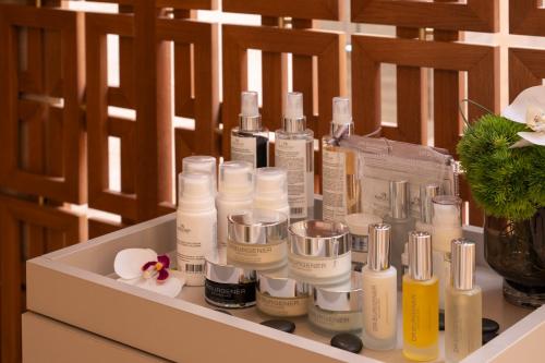 a bunch of bottles of lotion sitting on a shelf at Ayan Zalaat in Ulaanbaatar