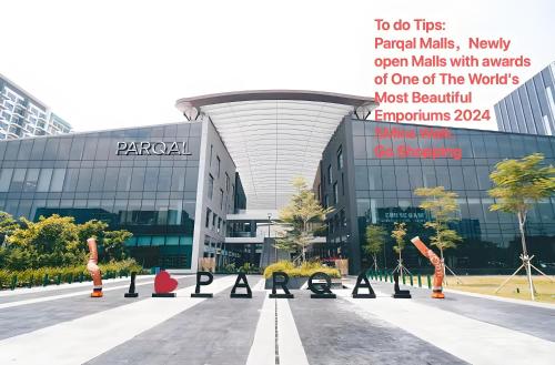 a parking lot in front of a large building at Playful 1BR With Magnificant Bayview Garden View Near Okada Solaire Aiports with Free Parking in Manila