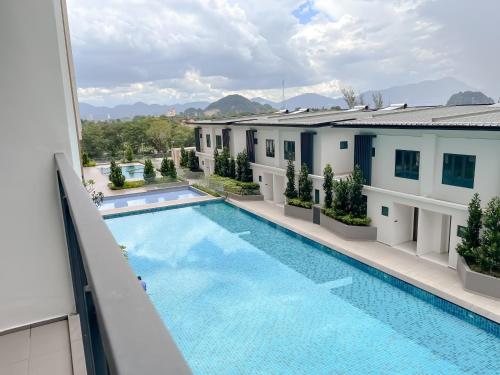 a view of a swimming pool from a building at Onsen Premium Hotspring Suite Sunway Tambun Ipoh in Tambun