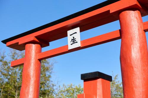 a red torii gate with a number on it at OneLife Retreat 