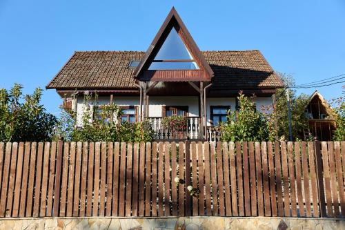 a wooden fence in front of a house at OneLife Retreat 