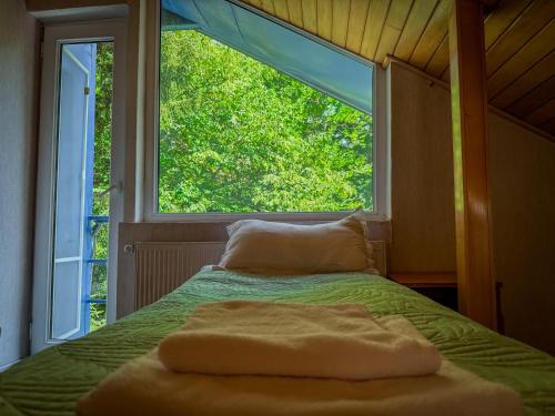 Postel nebo postele na pokoji v ubytování Nunisi Forest Hotel & SPA